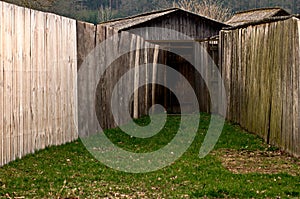 Old wooden hut and fence