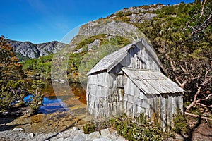Old wooden hut by lakeside in Cradle Mountain Lake St. Clair Nat