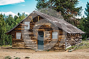 Old wooden hut of native people next to Auracauria Pehuen photo