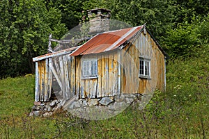 Old wooden hut at Tingvollfjorden, Norway