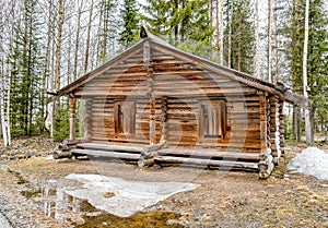 Old wooden hut in the woods.