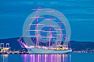 Old wooden illuminated sailboat night view