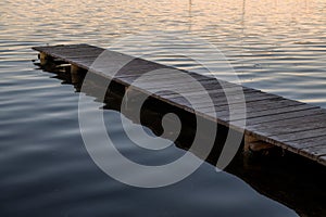 Old wooden jetty amongst ocean surface ripples
