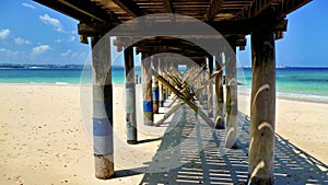 Old wooden jetty on the beach in Tanzania