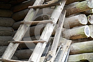 Old wooden ladder in front of historic barn