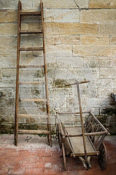 Old wooden ladder and wooden wagon