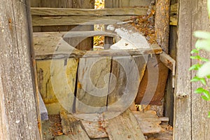 An old wooden latrine at a mining camp in the yukon