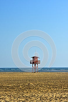old wooden lifeguard house on a lonely beach