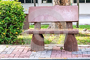 Old wooden log bench in a outdoor park