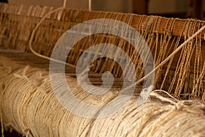 Old wooden loom in a rural house in Ukraine, an old spindle