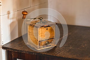 Old wooden manual coffee grinder