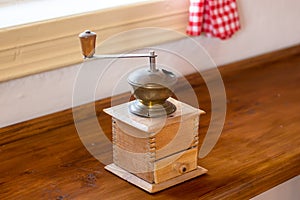 Old wooden manual coffee grinder