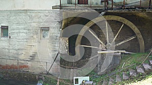 Old wooden mill powered by water falling on a wooden wheel to make flour in Serbian Ovcar and Kablar mountains natural park in