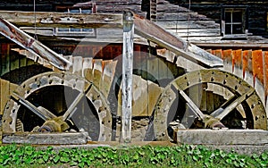 Old wooden mill with two overshot waterwheels