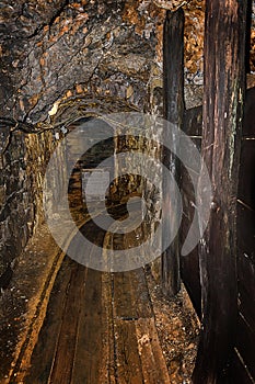 Old wooden mine chart in abandoned mine shaft with wooden timbering