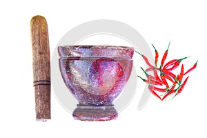 Old wooden mortar and pestle, red chillies isolated on white background. Concept for Thai kitchen equipment and ingredient