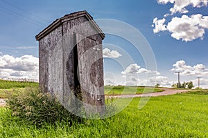 Old wooden outhouse on the prairies in Saskatchewan, Canada