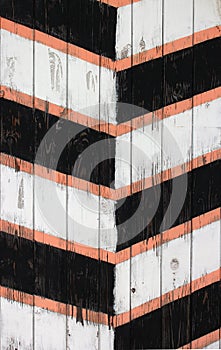 Old wooden painted striped guard post texture