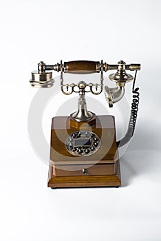 Old wooden phone on white