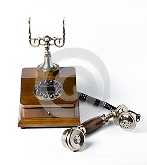 Old wooden phone on white