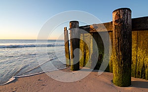 Old wooden pier on beach