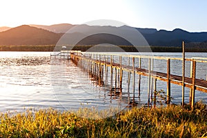 An old wooden pier photographed in the evening