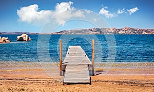 Old wooden pier on public beach of Rafael port, Province of Olbia-Tempio, Italy, Europe photo