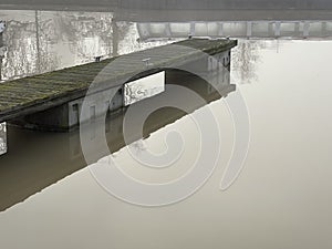 Old wooden pier in the river