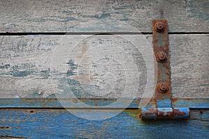 Old wooden plank surface attached with rusty iron