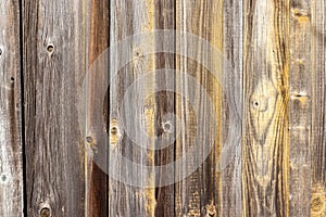 Old wooden plank texture background with traces of yellow paint