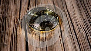 Old wooden planks and symbol of cryptocurrency gold bitcoin coin