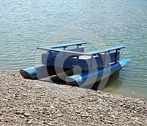 Old Wooden Pontoon Boat on Lake