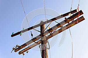 Old wooden power poles with glass insulators