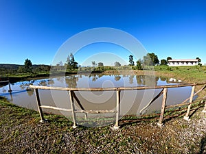 old wooden railing and bottom a well