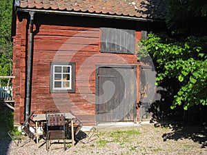 Old wooden red barn. Linkoping. Sweden photo