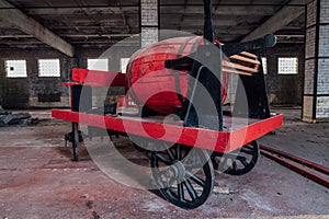 Old wooden red fire truck in abandoned building