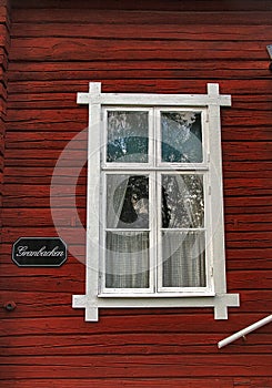 Old Swedish Wooden Red House With White Window photo