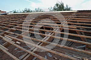 Old wooden roof under repair, roofing dismantling and renovation