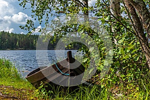 Old wooden rowing boat on the shore of the Saimaa lake in Finland - 2