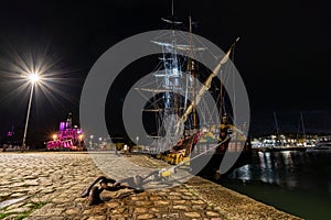 old wooden sail ships moored in the harbor of La Rochelle near the gabut district. night shot