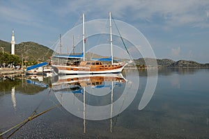 Old wooden sailing ship in the sea bay