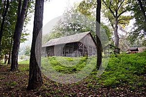 An old wooden shed on a mountain slope