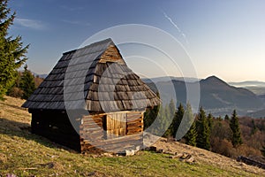 Old wooden shelter on the mountain meadow, pasture in slovak countryside