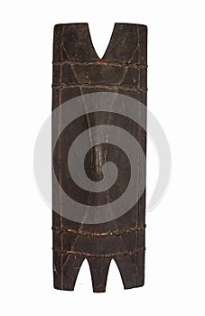 Old wooden shield under the lights isolated on a white background