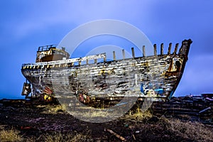 Old wooden ship on beach