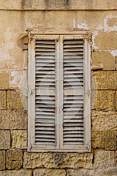 Old wooden shutter in Malta.