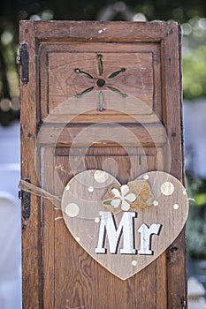 Old wooden shutter windows with hanging heart for Mr