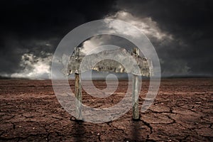 Old wooden sign on storm cloud with rain