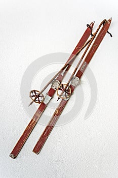 Old wooden skis on white background