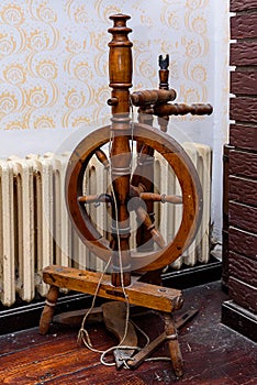 An old wooden spinning wheel.